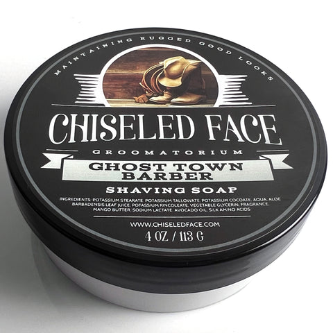 Top view of the 4oz tub of Chiseled Face Groomatorium's 'Ghost Town Barbershop' shaving soap, showing its closed plastic container.